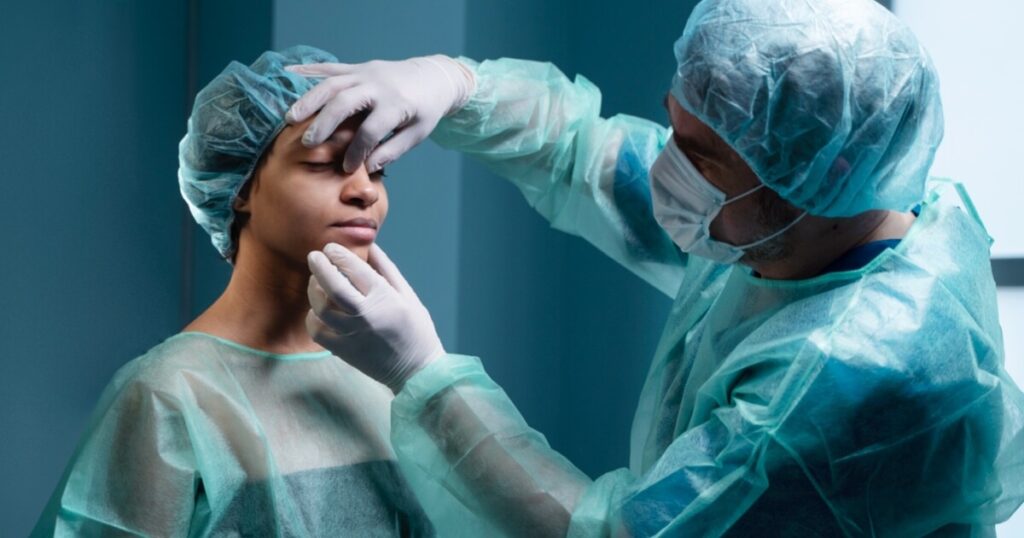 Doctor touching woman's nose for surgery. What is ultrasonic rhinoplasty?